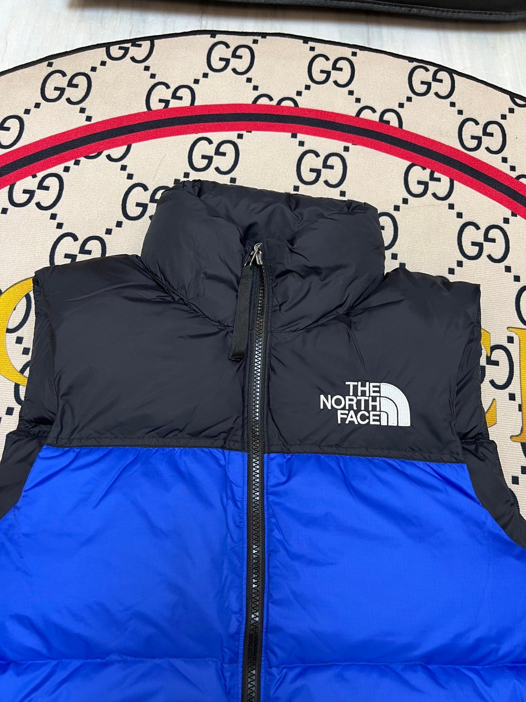 The North Face Puffer Vest in Royal Blue and Black with Stand Collar